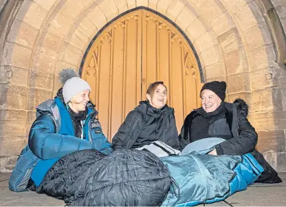  ?? Picture: Steve MacDougall. ?? Perth and Kinross Council staff, from left: Clare Mailer, Elaine Ritchie and Lisa Simpson sleeping out at St John’s Kirk as part of the big Sleep Out event.