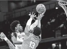  ?? Sarah Stier / Getty Images ?? Villanova’s Brandon Slater, left, secured two rebounds and asteal during an 84-61 victory over North Texas in the second round on Sunday.