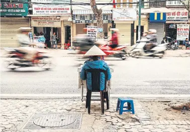  ?? ?? A morning street scene in Hanoi, Vietnam.