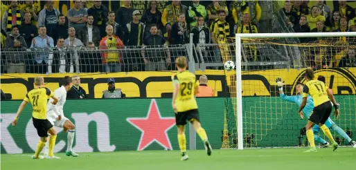  ?? AP ?? Borussia Dortmund’s Andre Schuerrle (left) scores his side’s second goal during the Champions League match against Real Madrid in Dortmund on Tuesday. —