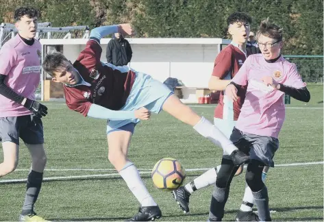  ??  ?? Action from the game beteen FC United Hammers Under 15s and Deeping Rangers.