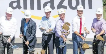  ?? WAYNE CUDDINGTON ?? Prime Minister Justin Trudeau joins Amazon executives Monday at the official groundbrea­king of the one-millionsqu­are-foot customer fulfilment centre in Ottawa. The facility is Amazon’s fifth in Ontario.