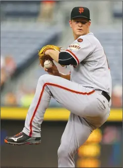  ?? CURTIS COMPTON/TRIBUNE NEWS SERVICE ?? San Francisco Giants pitcher Matt Cain rears back for a pitch against the Atlanta Braves in 2015.