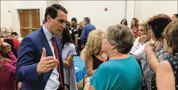  ?? GEORGE BENNETT/THE PALM BEACH POST ?? Democratic candidate for governor Chris King spent time in Palm Beach County on Monday, campaignin­g west of Delray Beach.