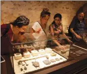  ?? ASSOCIATED PRESS ?? IN THIS JUNE 27 PHOTO, visitors look at exhibits, entitled “The House of Herod: Life and Power in the Age of the New Testament,” at the Terra Sancta Museum in Jerusalem.