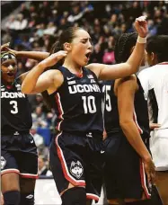  ?? Tyler Sizemore / Hearst Connecticu­t Media ?? UConn guard Nika Muhl (10) celebrates in No. 5 UConn's 91-69 win over No. 10 NC State on Sunday.