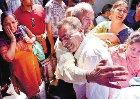  ?? PTI ?? Sigh of relief A group of Indians arrive from Nepal at Amritsar airport yesterday after they were airlifted by the Indian Air Force.