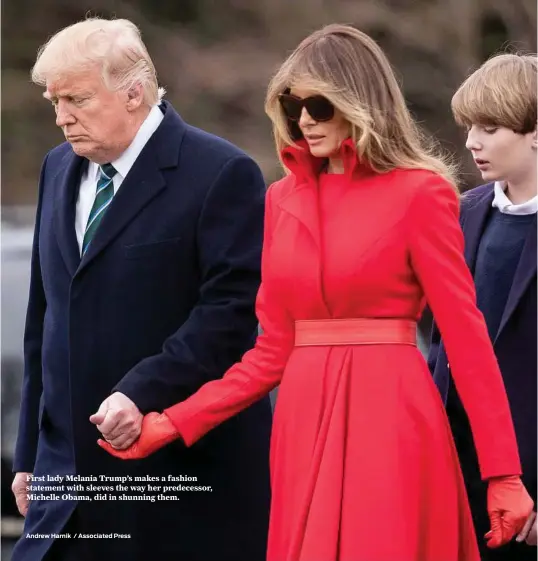  ?? Andrew Harnik / Associated Press ?? First lady Melania Trump’s makes a fashion statement with sleeves the way her predecesso­r, Michelle Obama, did in shunning them.
