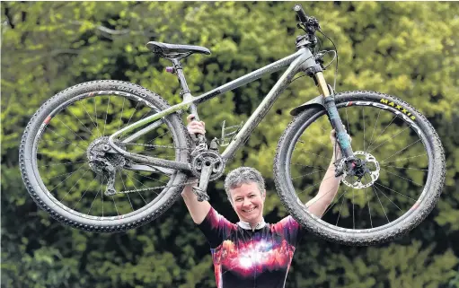  ?? PHOTO PETER MCINTOSH ?? On top . . . Champion endurance mountain biker Ronel Cook will chase a third consecutiv­e world title in Scotland later this month.