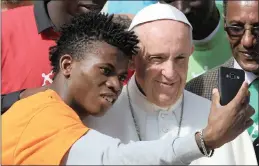  ?? PICTURE: REUTERS ?? Pope Francis poses for a selfie with a migrant during the Wednesday general audience in St Peter’s Square at the Vatican on September 27.