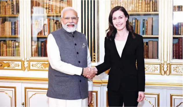  ?? Agence France-presse ?? ↑
Narendra Modi greets Sanna Marin (right) ahead of the second India-nordic Summit at Christians­borg Castle in Copenhagen on Wednesday.