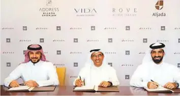  ??  ?? From right: Shaikh Sultan Bin Ahmad Al Qasimi, Chairman of Arada, Mohammad Alabbar, Chairman of Emaar Properties, and Prince Khalid Bin Al Waleed Bin Talal Al Saud, Vice-Chairman of Arada at the signing of the deal to manage three hotels in Aljada...