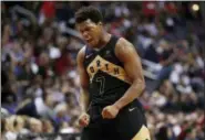  ?? ALEX BRANDON — THE ASSOCIATED PRESS ?? Toronto Raptors guard Kyle Lowry celebrates late in the second half of Game 6 of the team’s NBA basketball firstround playoff series against the Washington Wizards, Friday in Washington. The Raptors won 102-92.