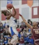  ?? JOHN BLAINE — FOR THE TRENTONIAN ?? Trenton’s Catholic’s Naomi Shorts (0) shoots over the defense of Gloucester Catholic’s Azana Baines (15) during the Non-Public B final at Jackson Liberty on Wednesday night.