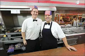  ?? ALEX HORVATH / THE CALIFORNIA­N ?? Brothers Joseph, left, and Jeremy Trammell, right, operate the last Woolworth’s diner in the country in downtown Bakersfiel­d. They decided not to set up outdoor seating nor require employees to wear masks and keep the business running as usual. They are operating “like a speakeasy,” Joseph Trammel said.