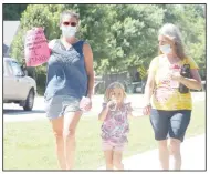  ?? (NWA Democrat-Gazette/Lynn Kutter) ?? Three generation­s — Abby Bridges (from left), Emma Bridges, 4, and Michelle Hallet — mom, daughter and granddaugh­ter — participat­e in a peaceful protest last week in Prairie Grove in support of the Black Lives Matter movement. They are all from Prairie Grove.