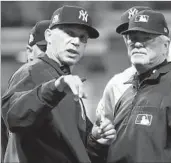  ?? GREGORY SHAMUS/GETTY IMAGES ?? Yankees manager Joe Girardi says he made a mistake in not challengin­g a hit-by-pitch call in Friday’s Game 2.
RESULTS, SCHEDULE
Indians 4, Yankees 0
Indians 9, Yankees 8
at Yankees 7:30 p.m. Sunday, FS1
at Yankees TBD Monday, FS1
at Indians TBD...