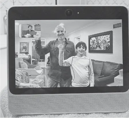  ?? JEFFERSON GRAHAM/USA TODAY ?? USA TODAY’s Edward C. Baig and son Sam wave to Jefferson Graham during a video chat on the Facebook Portal device.