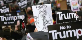  ?? REUTERS ?? Demonstrat­ors march against US President Donald Trump and his temporary ban on refugees and nationals from seven Muslim-majority countries from entering the United States, during a protest in London, on Saturday.