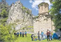  ?? Margo Pfeiff ?? A POPULAR rock-climbing spot rises alongside a 15th century monastery in the Matka Canyon west of Skopje, Macedonia.