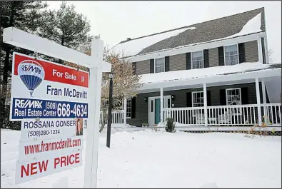  ?? AP file photo ?? A for-sale sign hangs in front of a home in Walpole, Mass. The total supply of homes for sale dipped in January to 1.52 million, the fewest for any January since records began in 1999.