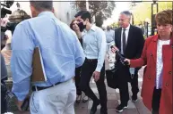  ?? Arnold Gold / Hearst Connecticu­t Media ?? State Rep. Michael DiMassa, D-West Haven, center, leaves the federal courthouse in New Haven with his attorney John Gulash following his arrest Wednesday.