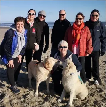  ??  ?? Catherine Walsh (far left) with friends on Curracloe beach on Sunday morning enjoying an earlymorni­ng walk in preparatio­n for this year’s Hope & Dream 10.