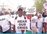  ??  ?? BANJUL: A demonstrat­or holds up a placard while demonstrat­ing, asking for Yahya Jammeh, the former President of the Gambia, to be brought to justice, in Banjul. — AFP