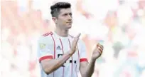  ?? Reuters ?? Bayern Munich’s Robert Lewandowsk­i applauds fans at the end of their match against Hanover 96 at the Hdi-arena in Hanover on Saturday.