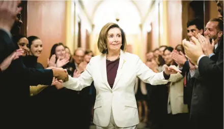  ?? ERIN SCHAFF/THE NEW YORK TIMES ?? House Speaker Nancy Pelosi is applauded by staffers after she announced her future plans.