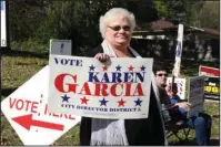  ?? The Sentinel-Record/Richard Rasmussen ?? OUT IN FRONT: District 5 Director Karen Garcia campaigns Tuesday outside Oaklawn First Church of God. Unofficial results show her leading former District 5 Director Rick Ramick by more than 28 percentage points.
