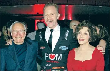  ?? FilmMagic ?? STEWART AND LYNDA Resnick, flanking director Morgan Spurlock at the premiere of a film sponsored by Wonderful Co. in 2011, are engaged in a legal battle with pistachio grower Assemi Bros. of Fresno.