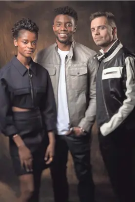  ?? DAN MACMEDAN/USA TODAY ?? Letitia Wright, Chadwick Boseman and Sebastian Stan, last seen in “Black Panther,” come together in “Avengers: Infinity War.”