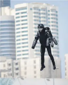  ??  ?? Above, Richard Browning demonstrat­es his jetpack in Dubai last month. Top, an artist’s impression of Uber’s planned flying taxi