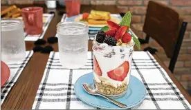  ?? CONTRIBUTE­D ?? A new breakfast, lunch and brunch restaurant called redBERRY is now open in the former Sherwood Shopping Centre in north Troy. The berry parfait is among the restaurant’s signature dishes.