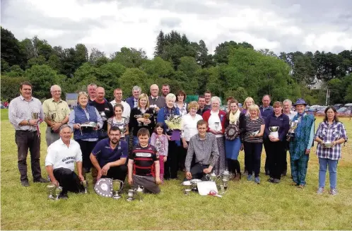  ??  ?? Accolades Trophy winners in the agricultur­al show and games, including many from the Home Industries tent