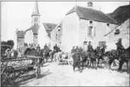  ?? THE ASSOCIATED PRESS ?? French cavalry marching through northern France, after driving the Germans back in an undated photo. They were messengers, spies, sentinels and the heavy haulers of World War I, carrying supplies, munitions and food and leading cavalry charges. The horses, mules, dogs and pigeons were a vital part of the Allied war machine, saving countless lives — and dying by the millions.