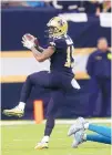  ?? BUTCH DILL/AP ?? New Orleans wide receiver Ted Ginn pulls in a touchdown reception during Sunday’s game against Carolina.