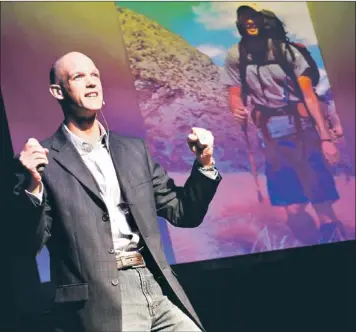  ?? — Submitted photos ?? (Above) Shawn Stratton speaks at a 2012 TEDx event in St. John’s. (Right) Stratton captures an image of children in a remote village in Pindari Valley, India, after playing a game of kickball.