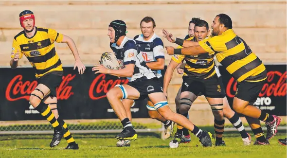  ?? Pictures: MICHAEL FRANCHI ?? Felix Goldrick breaks clear for Casuarina against Darwin in their NT Rugby Union clash yesterday