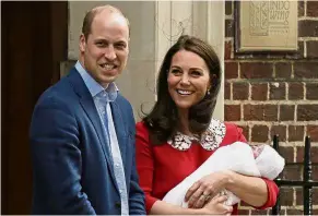  ?? — AP ?? Welcome to the family: William and Kate leaving St Mary’s Hospital in London with baby Louis.