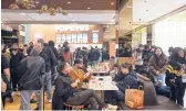  ?? MARY TURNER/THE NEW YORK TIMES ?? Customers jam Popeyes last week at Westfield Stratford City mall in East London.