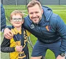  ?? ?? All smiles Rutkiewicz, right, pictured with Saturday’s EK mascot Finlay McGhee