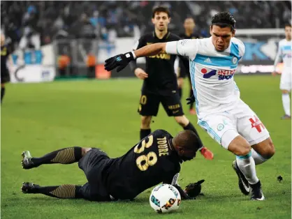  ??  ?? MARSEILLE: Monaco’s defender Almamy Toure (L) vies with Olympique de Marseille’s Dutch defender Karim Rekik (R) during the French L1 football match Marseille vs Monaco on Sunday at the Velodrome stadium in Marseille, southern France. —AFP