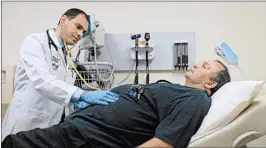  ?? JAHI CHIKWENDIU/WASHINGTON POST 2015 ?? Former coal miner Gary Ryan, of Kentucky, gets a checkup. Kentucky is one of the states that requested the ability to require non-disabled, adult Medicaid recipients to work.