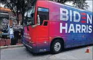  ?? NEWS VIA THE ASSOCIATED PRESS] ?? Democratic supporters cheer as the Biden-Harris campaign bus arrives at Vera Minter Park on Wednesday in Abilene, Texas. [RONALD W. ERDRICH/ THE ABILENE REPORTER