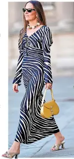  ?? ?? Alba Garavito Torre wears a zebra print pattern dress from Nocturne and a yellow bag