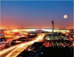  ??  ?? Zhengzhou Airport at night. With an annual handling capacity apacity of 20 million passengers and 450,000 00 tons of cargo, the airport in Henan Province vince has played a lead ead role in accelerati­ng ating the implementa­tion ation of the Belt and...