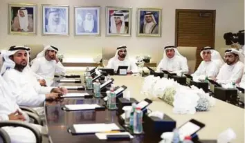  ?? WAM ?? Shaikh Mohammad listens to a presentati­on by Humaid Bin Mohammad Al Qutami on the Dubai Health Authority’s plans and initiative­s, including the Rashid Medical Complex project, at the DHA’s head office yesterday.