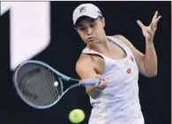  ?? (AFP) ?? Australia’s Ashleigh Barty hits a return against Russia’s Ekaterina Alexandrov­a during their women’s singles match at the Australian Open in Melbourne on Saturday.